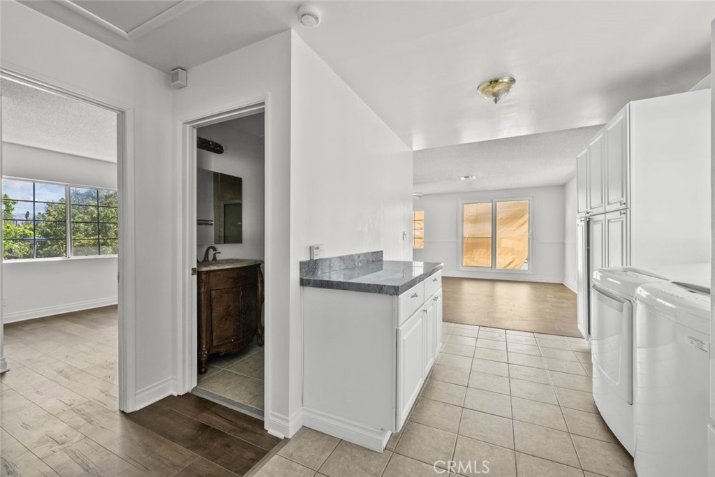 10528 1/2 Hillhaven Avenue Tujunga, CA 91042 - Photo 23 of 28 a kitchen with granite countertop a sink and a refrigerator