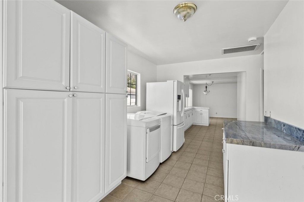 10528 1/2 Hillhaven Avenue Tujunga, CA 91042 - Photo 24 of 28 a en suite bathroom with a granite countertop sink and a mirror