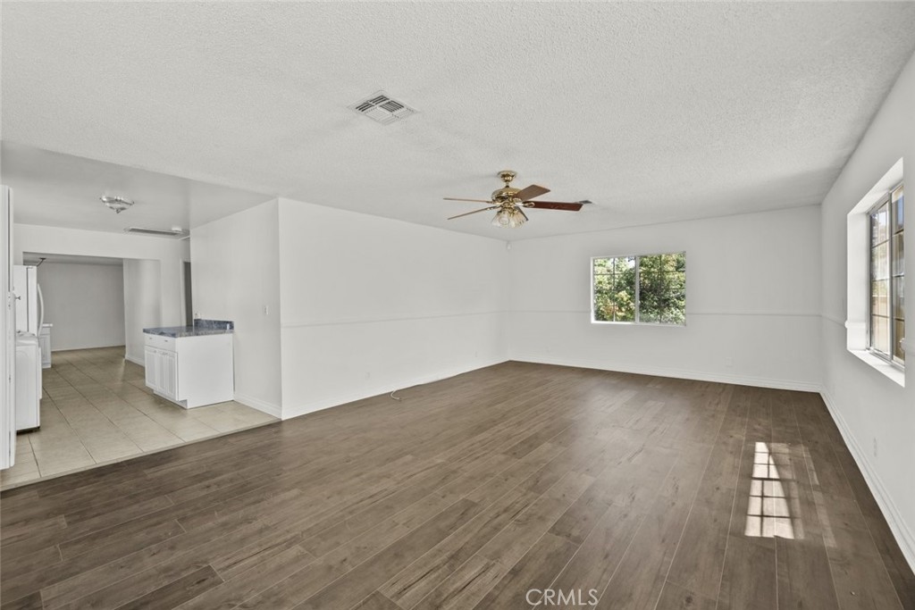 10528 1/2 Hillhaven Avenue Tujunga, CA 91042 - Photo 25 of 28 wooden floor in an empty room with a window