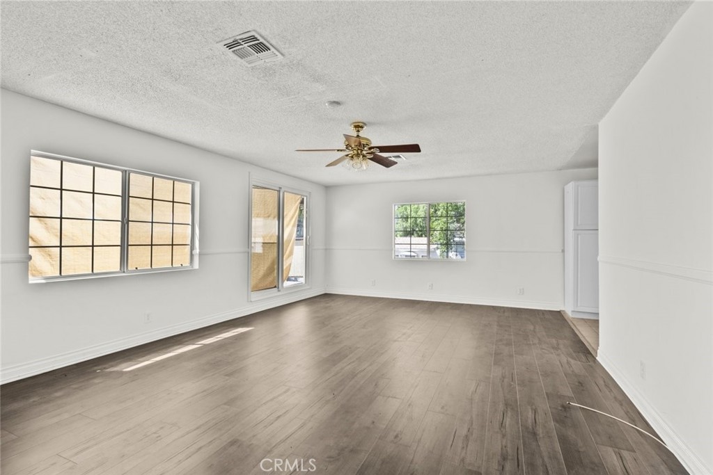 10528 1/2 Hillhaven Avenue Tujunga, CA 91042 - Photo 26 of 28 wooden floor in an empty room with a window
