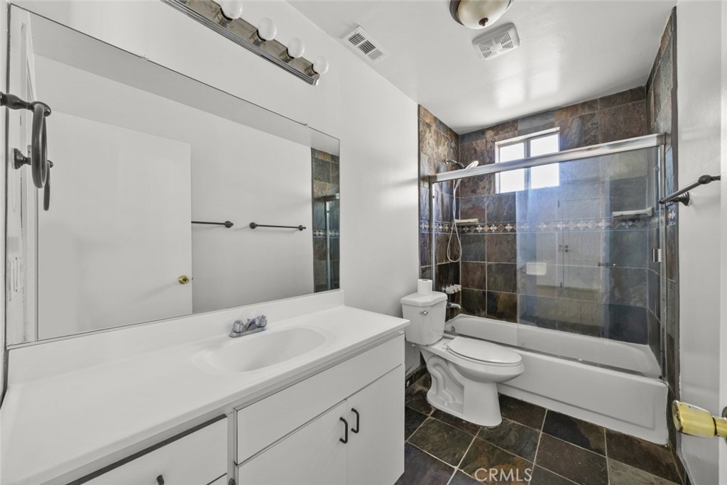 10528 1/2 Hillhaven Avenue Tujunga, CA 91042 - Photo 4 of 28 a bathroom with a sink toilet and shower