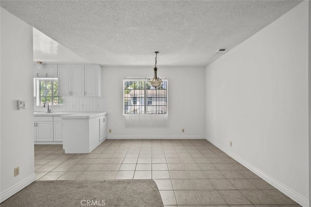 10528 1/2 Hillhaven Avenue Tujunga, CA 91042 - Photo 5 of 28 a view of an empty room with a window