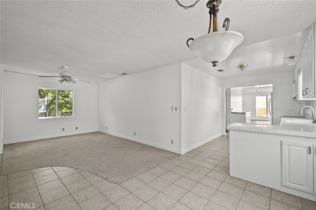 10528 1/2 Hillhaven Avenue Tujunga, CA 91042 - Photo 6 of 28 a view of a kitchen with a sink and chandelier fan