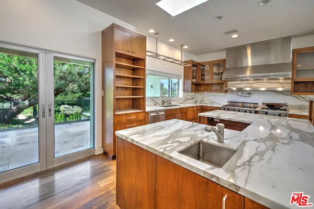 a bedroom with a large bed and a large window