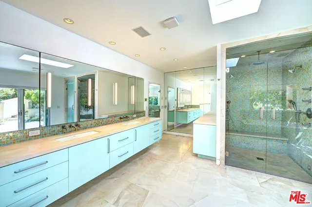 a house with a swimming pool in front of it