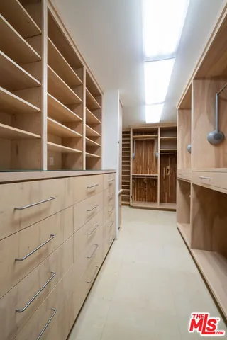 a bathroom with a double vanity sink mirror and shower
