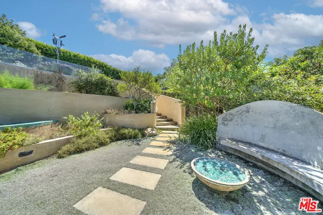 a bathroom with a shower sink and mirror