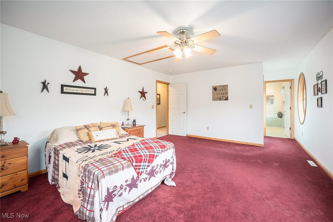 2073 Sexton Road Austinburg, OH 44010 - Photo 15 of 32 Bedroom with carpet flooring and ceiling fan
