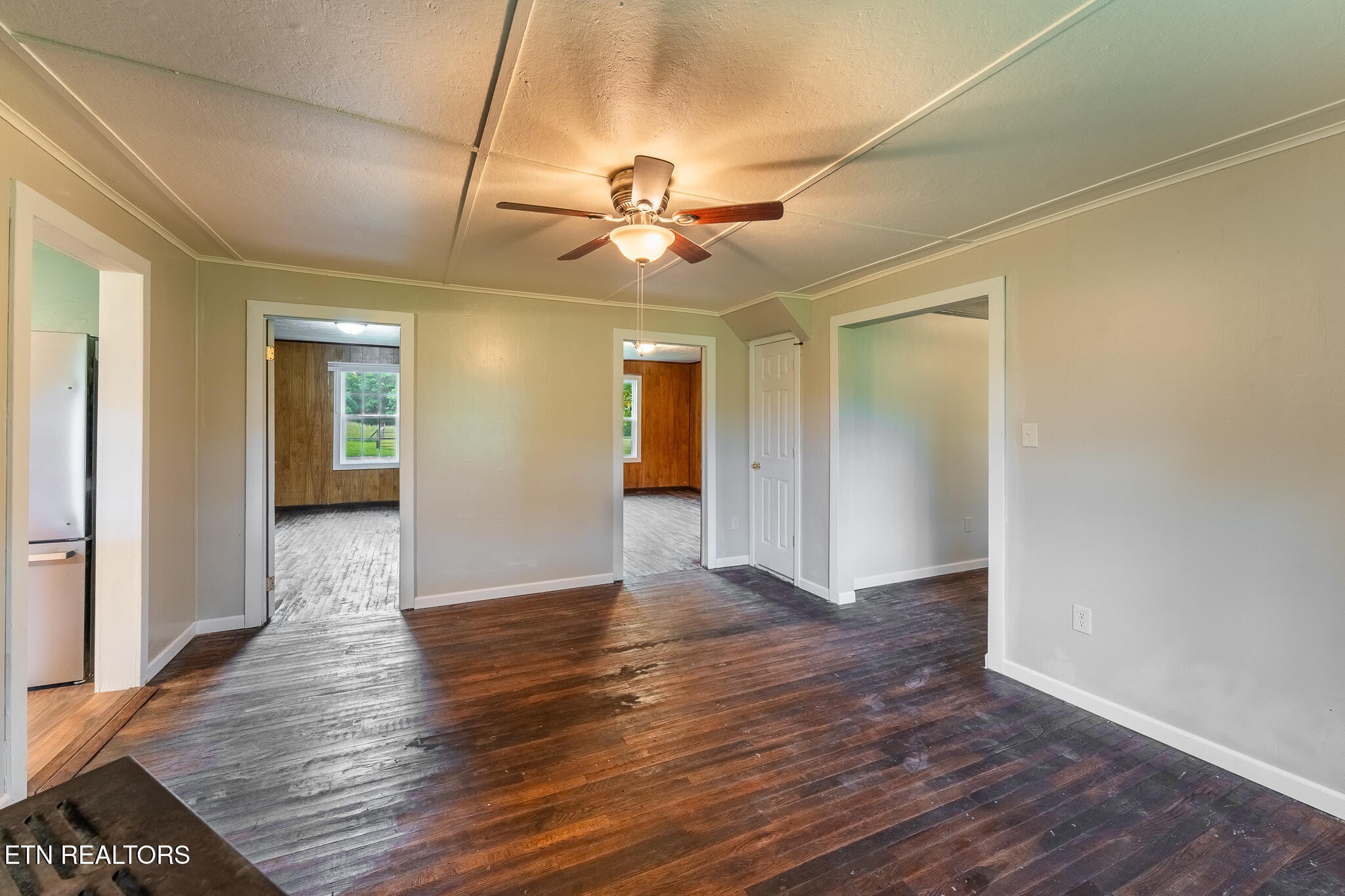 2530 Roslin Road Deer Lodge, TN 37726 - Photo 14 of 58 a view of an empty room with window and wooden floor