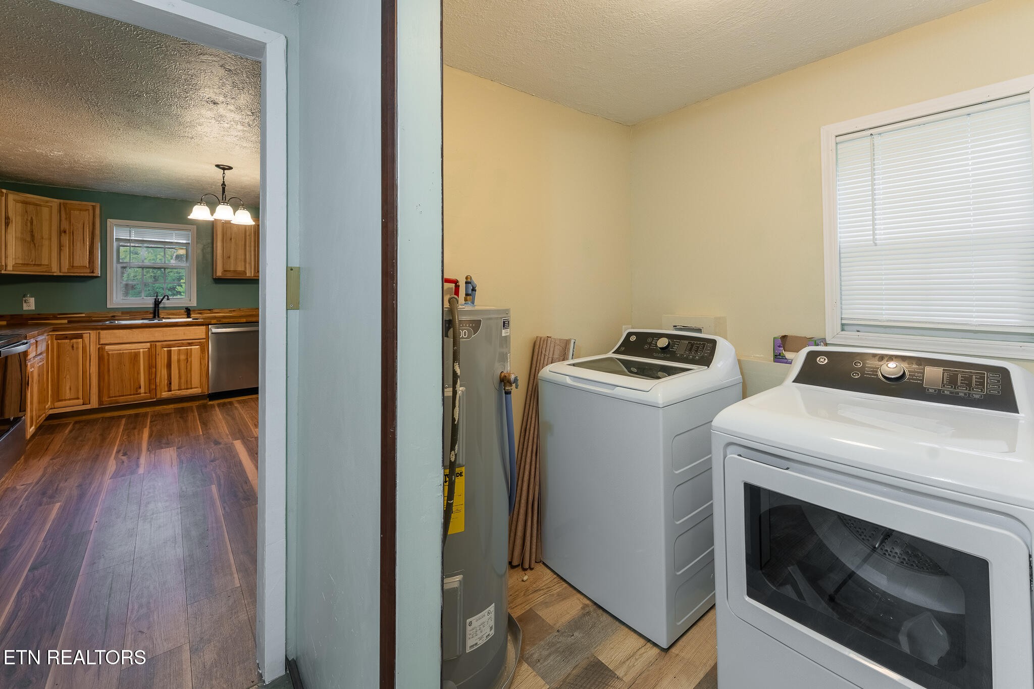 2530 Roslin Road Deer Lodge, TN 37726 - Photo 29 of 58 a view of washer and dryer with wooden floor