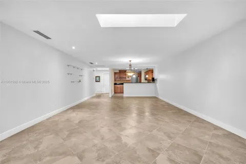 a kitchen with a sink cabinets and window