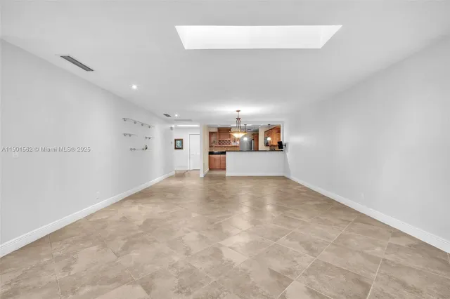 a kitchen with a sink cabinets and window