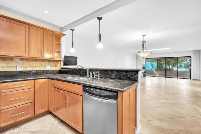 a view of an empty room with window and cabinet