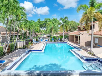 an aerial view of a house with a garden