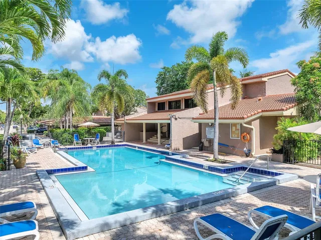 an aerial view of a house with garden space and street view