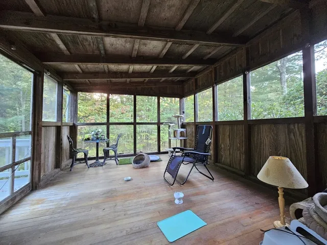 a view of a room with gym equipment and a large window
