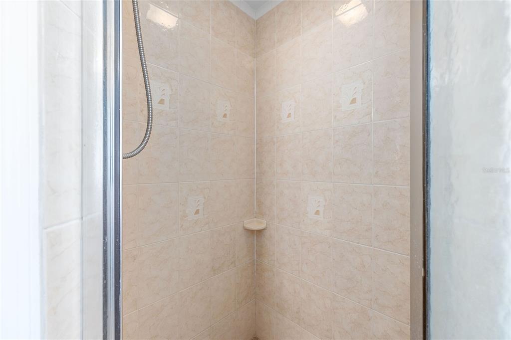 15434 Southwest 23rd Court Road Ocala, FL 34473 - Photo 28 of 41 a bathroom with a white shower