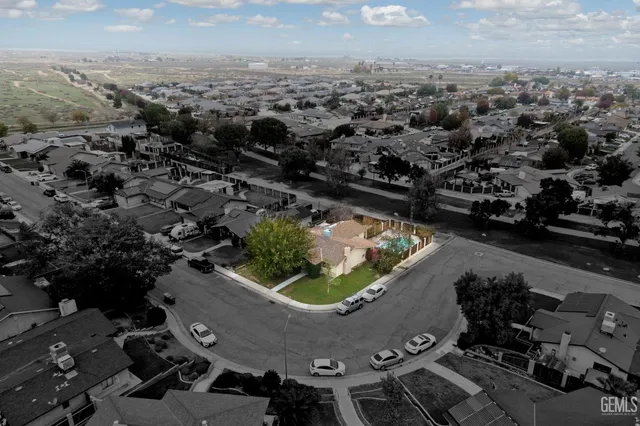 an aerial view of a house with a lake view