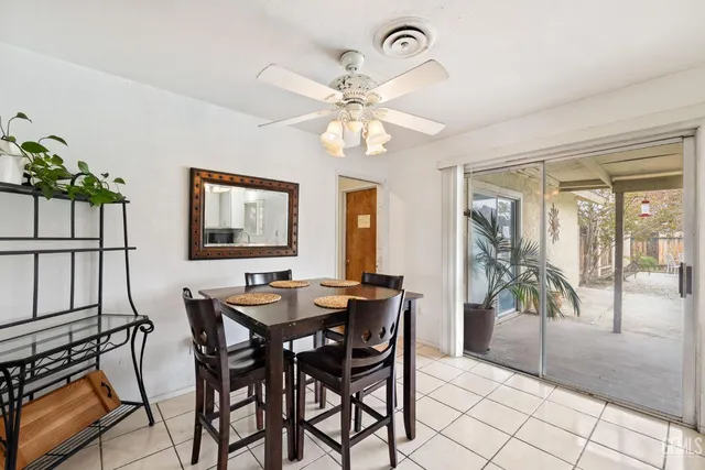 a dining room with furniture a livingroom and chandelier