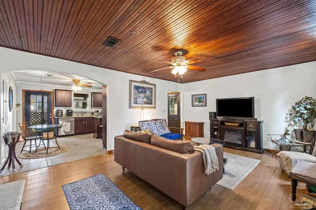 a kitchen with stainless steel appliances a stove a sink and a microwave