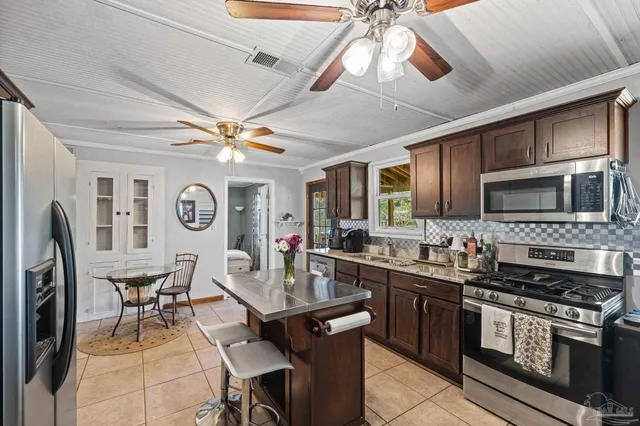 a bedroom with a large bed and a large window