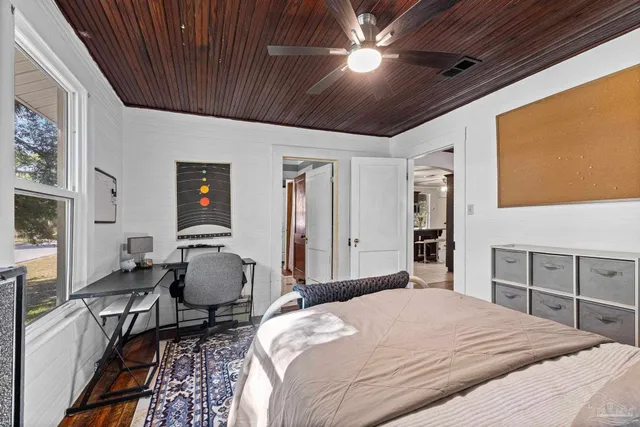 a front view of house with yard and outdoor seating