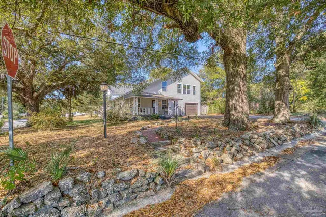 a front view of a house with a porch