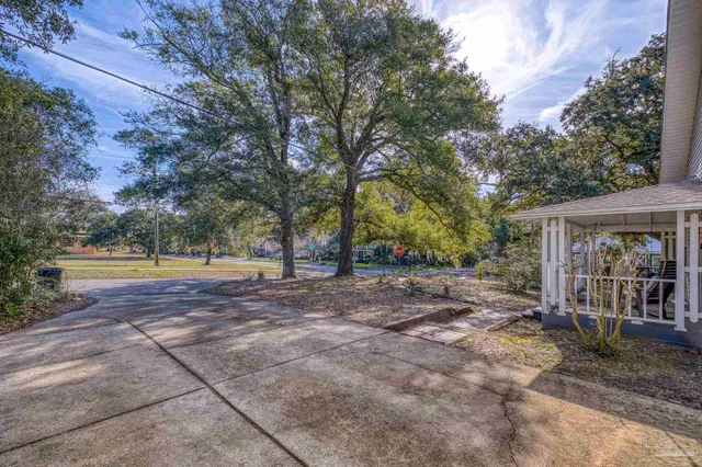a kitchen with stainless steel appliances granite countertop a sink refrigerator and cabinets