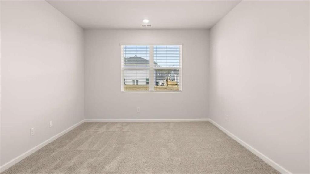 306 Friendship Oak Way Hampton, GA 30228 - Photo 21 of 41 an empty room with a window
