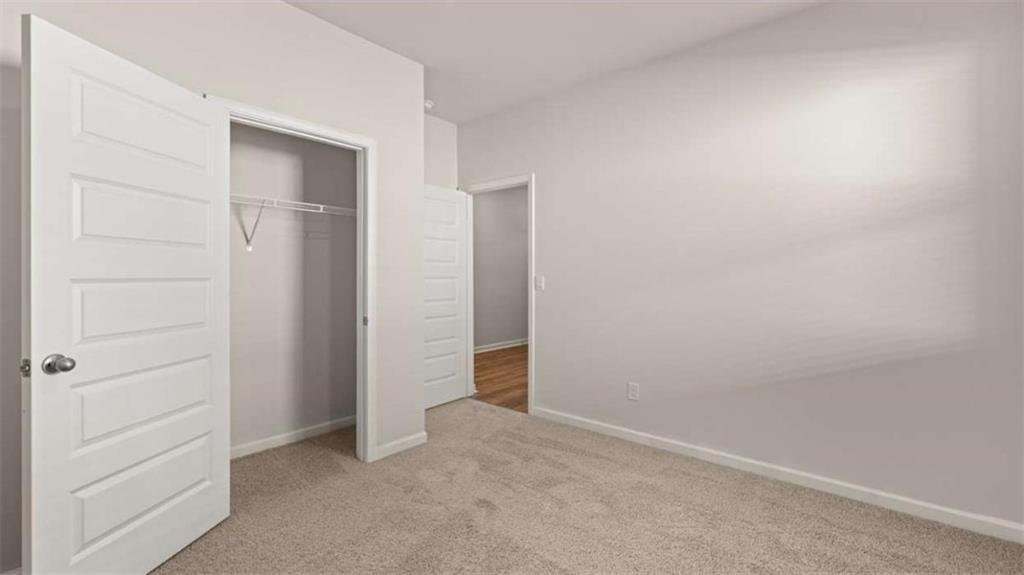 306 Friendship Oak Way Hampton, GA 30228 - Photo 28 of 41 an empty room with closet