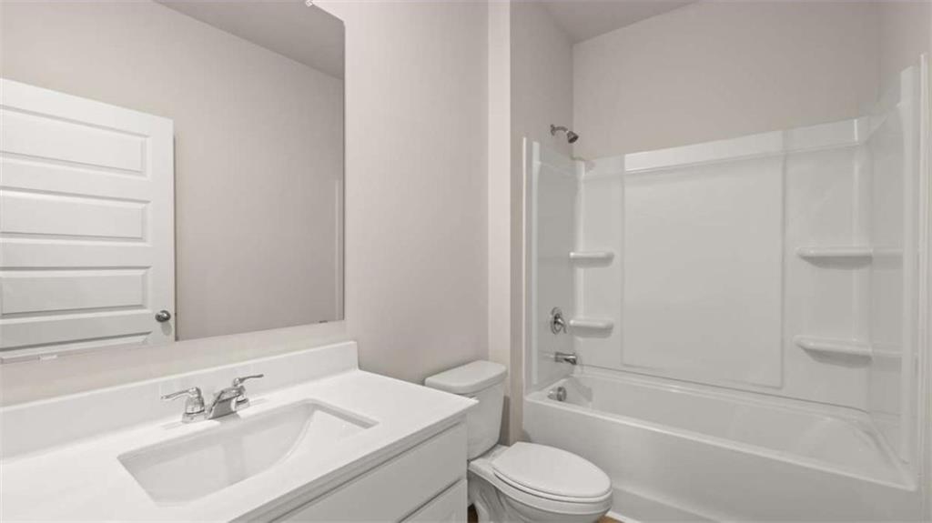 306 Friendship Oak Way Hampton, GA 30228 - Photo 32 of 41 a bathroom with a sink toilet and shower