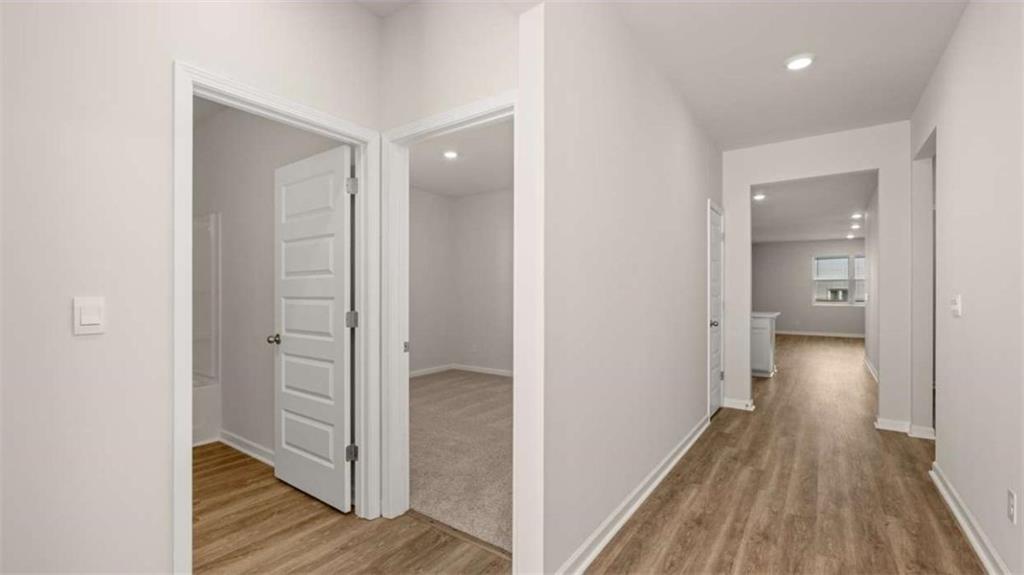 306 Friendship Oak Way Hampton, GA 30228 - Photo 6 of 41 a view of a hallway with wooden floor