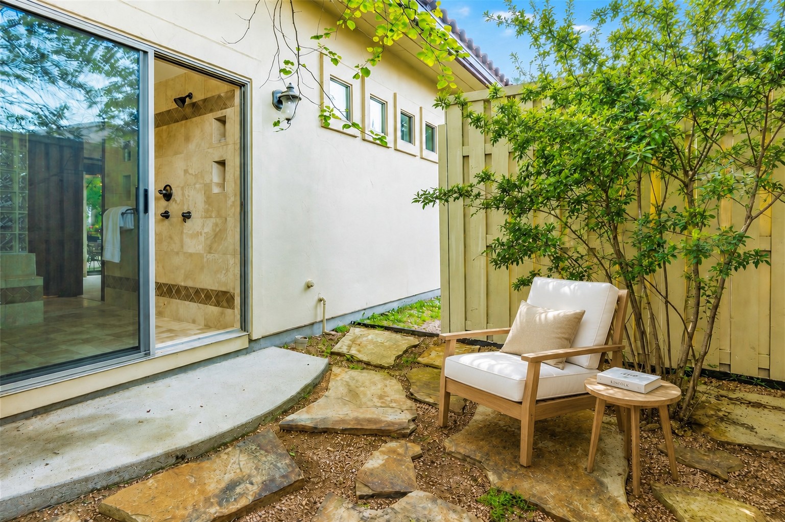 407 Hurst Creek Road Lakeway, TX 78734 - Photo 17 of 40 Keep the glass door open or shut in the indoor/outdoor shower which is fully private and gives you a place to relax before getting ready for the day. Bring a cup of coffee before getting ready for the day in this quiet nook.