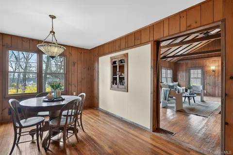 a dining room with furniture window wooden floor