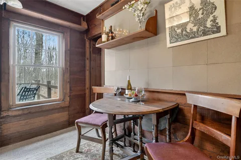 a view of a dining room with furniture and window