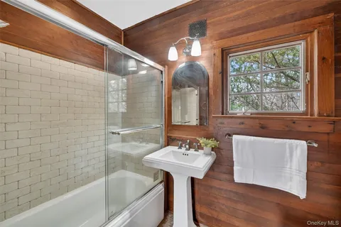 a bathroom with a sink bathtub and a shower