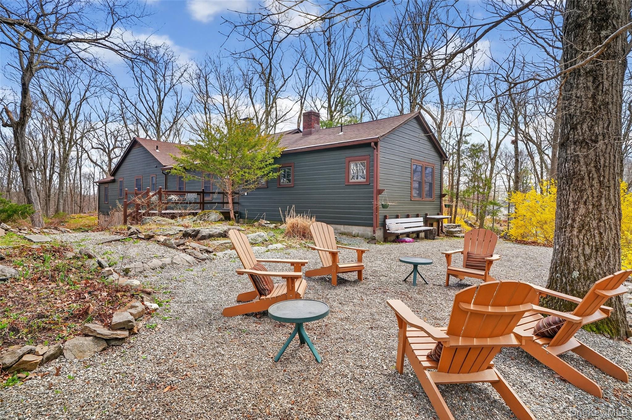 270 Colonel Greene Road Yorktown Heights, NY 10598 - Photo 25 of 26 a backyard of a house with table and chairs