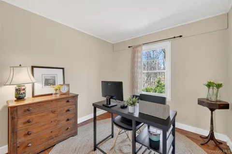 a view of a workspace with furniture