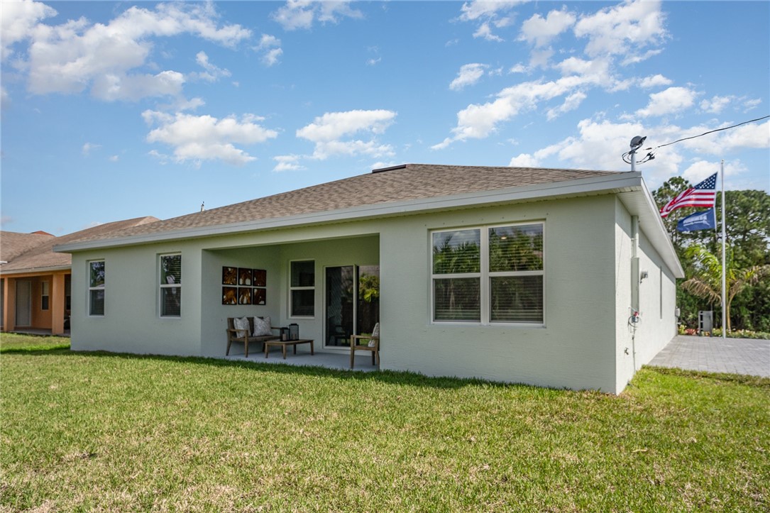 502 Saunders Street Sebastian, FL 32958 - Photo 30 of 30 a view of a house with porch and garden
