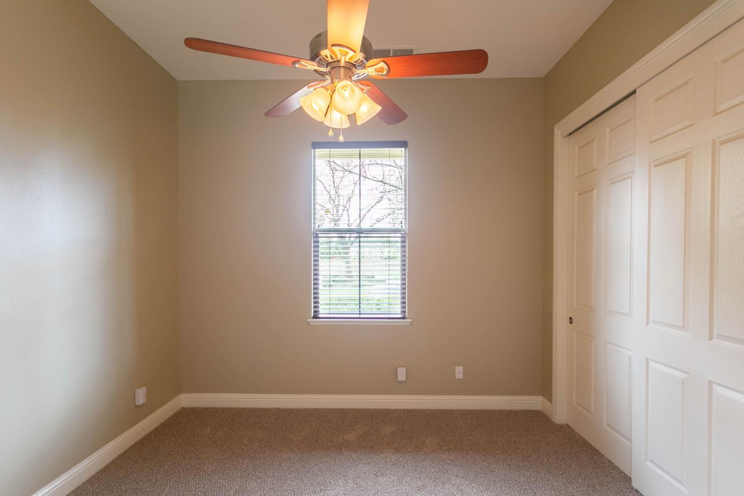 3271 Graybark Avenue Clovis, CA 93619 - Photo 15 of 26 an empty room with a window