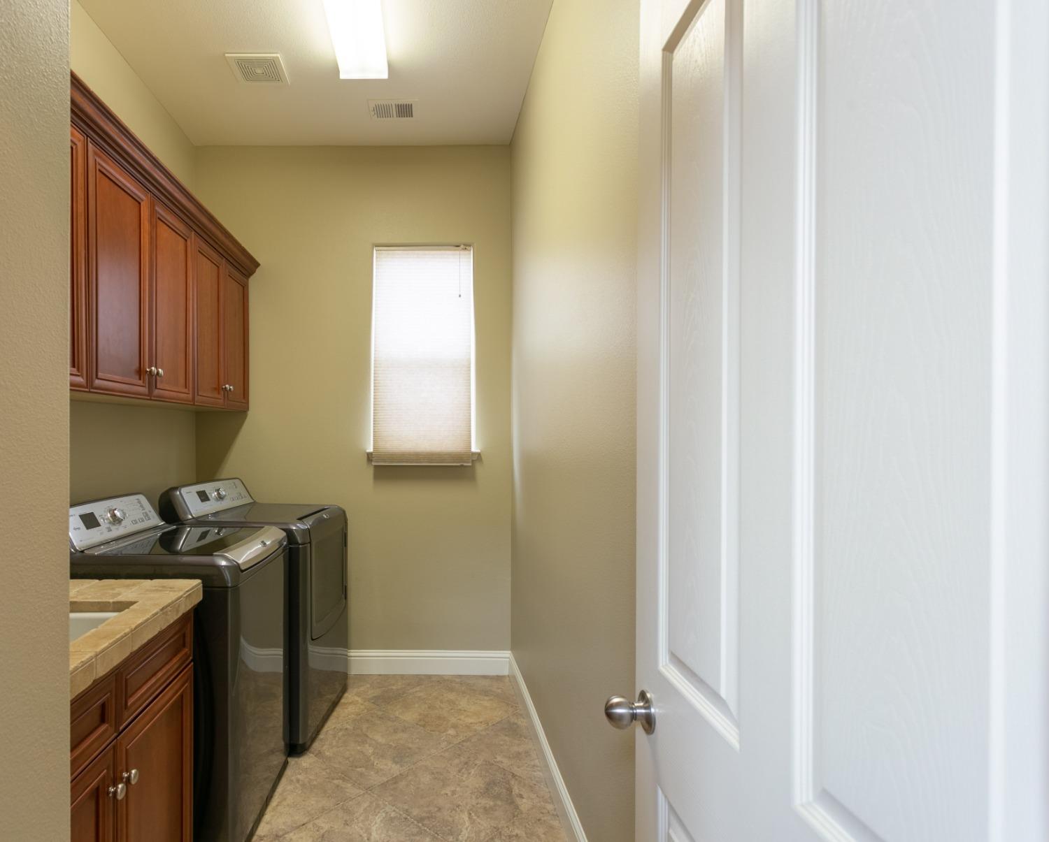 3271 Graybark Avenue Clovis, CA 93619 - Photo 17 of 26 a room with storage and utility