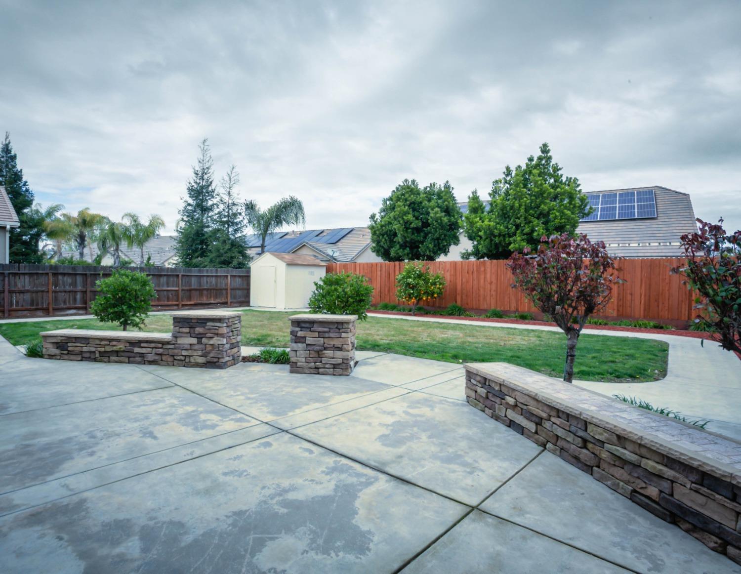 3271 Graybark Avenue Clovis, CA 93619 - Photo 23 of 26 a view of a house with a yard and sitting area