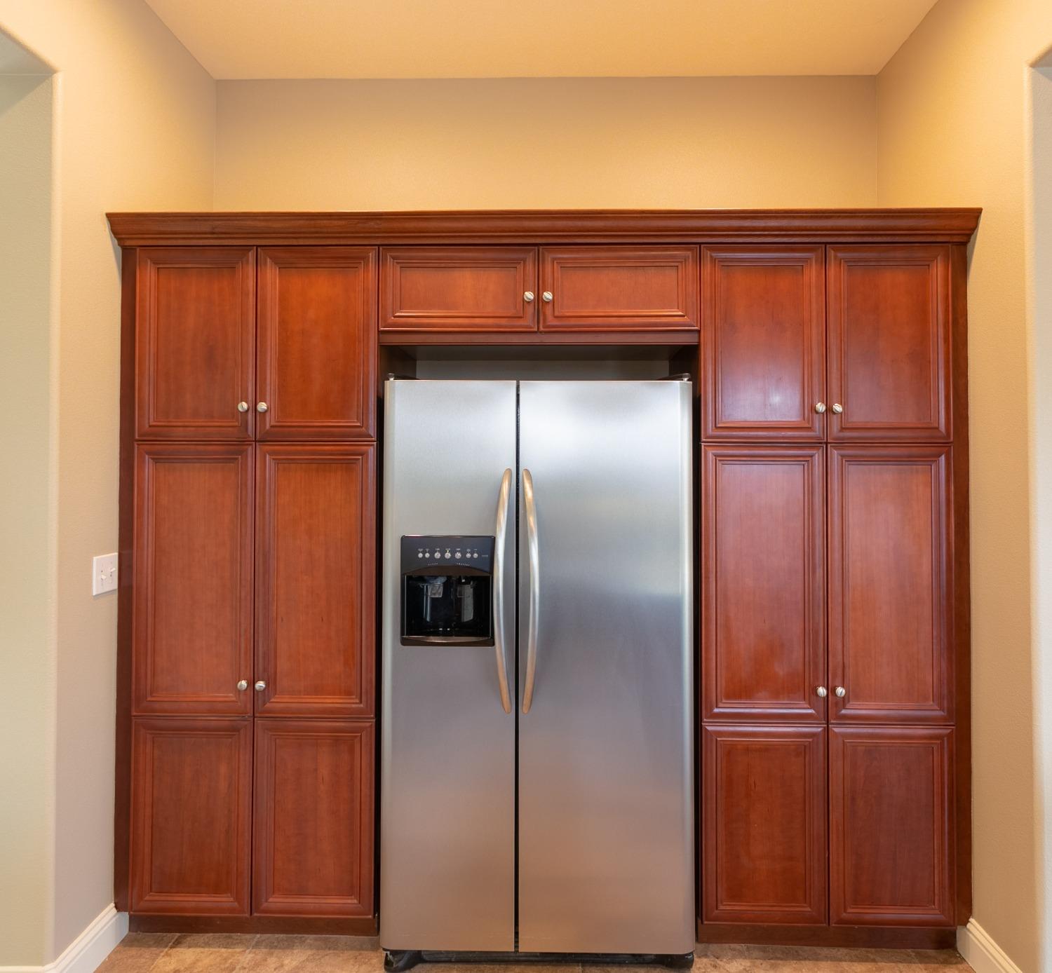 3271 Graybark Avenue Clovis, CA 93619 - Photo 7 of 26 a close view of wooden cabinet