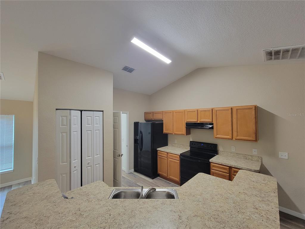 7009 Hemlock Road Ocala, FL 34472 - Photo 5 of 10 a bedroom with a bed and cabinets