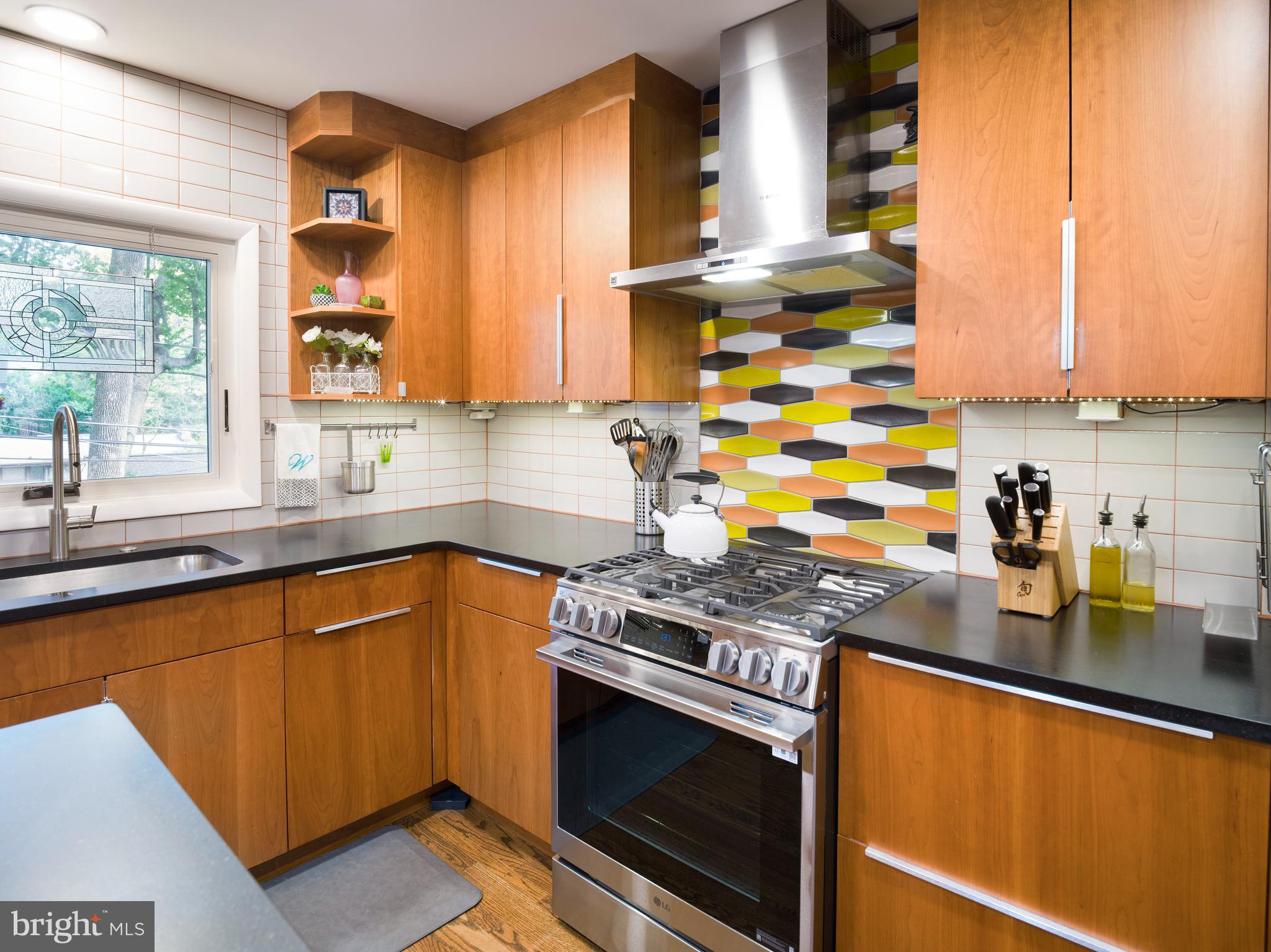 123 Old Forest Road Wynnewood, PA 19096 - Photo 11 of 29 a kitchen with stainless steel appliances granite countertop a sink stove and cabinets