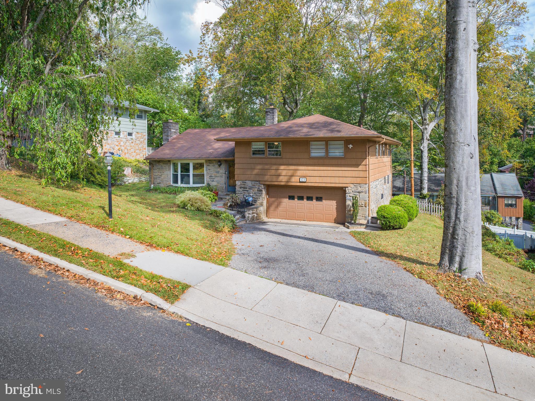 123 Old Forest Road Wynnewood, PA 19096 - Photo 2 of 29 a front view of a house with garden