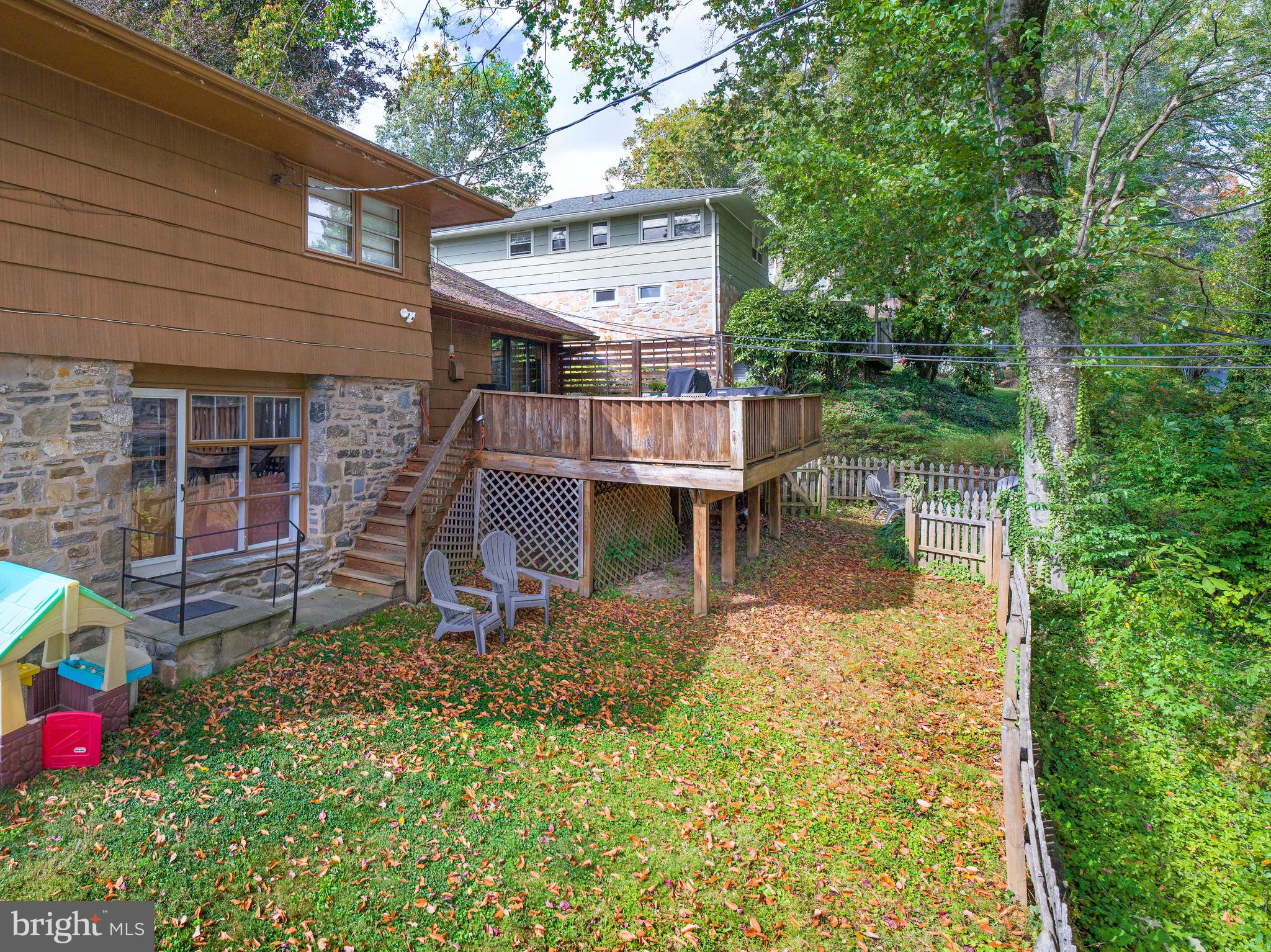 123 Old Forest Road Wynnewood, PA 19096 - Photo 26 of 29 a backyard of a house with table and chairs