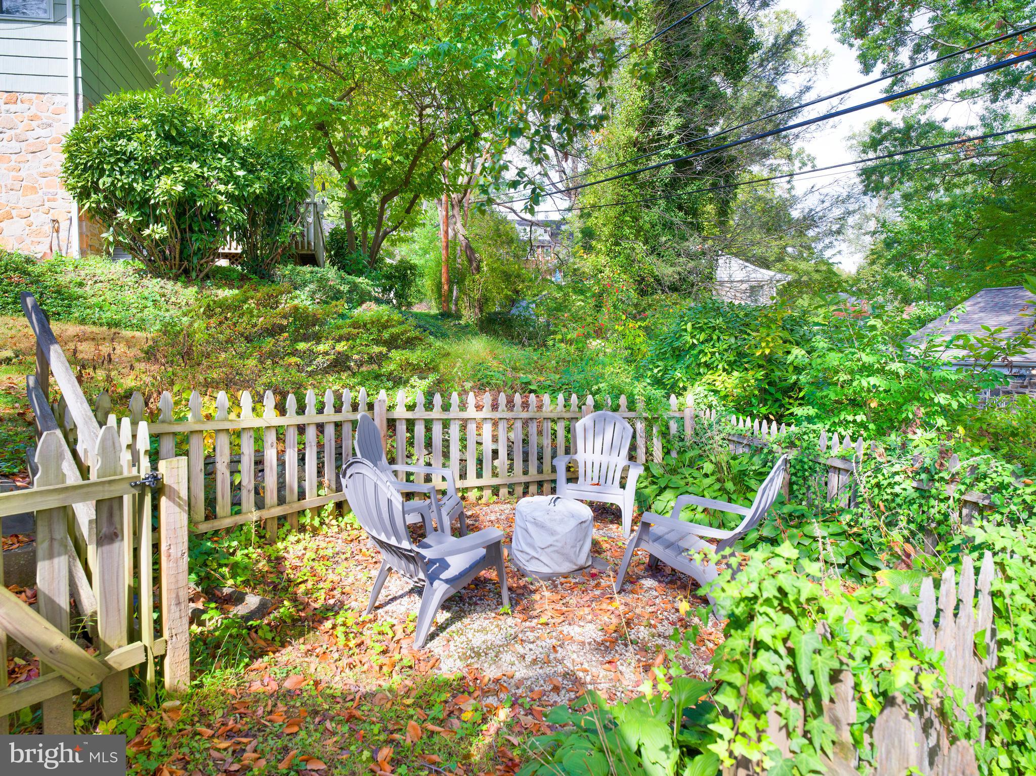 123 Old Forest Road Wynnewood, PA 19096 - Photo 28 of 29 a view of a chair and table in backyard