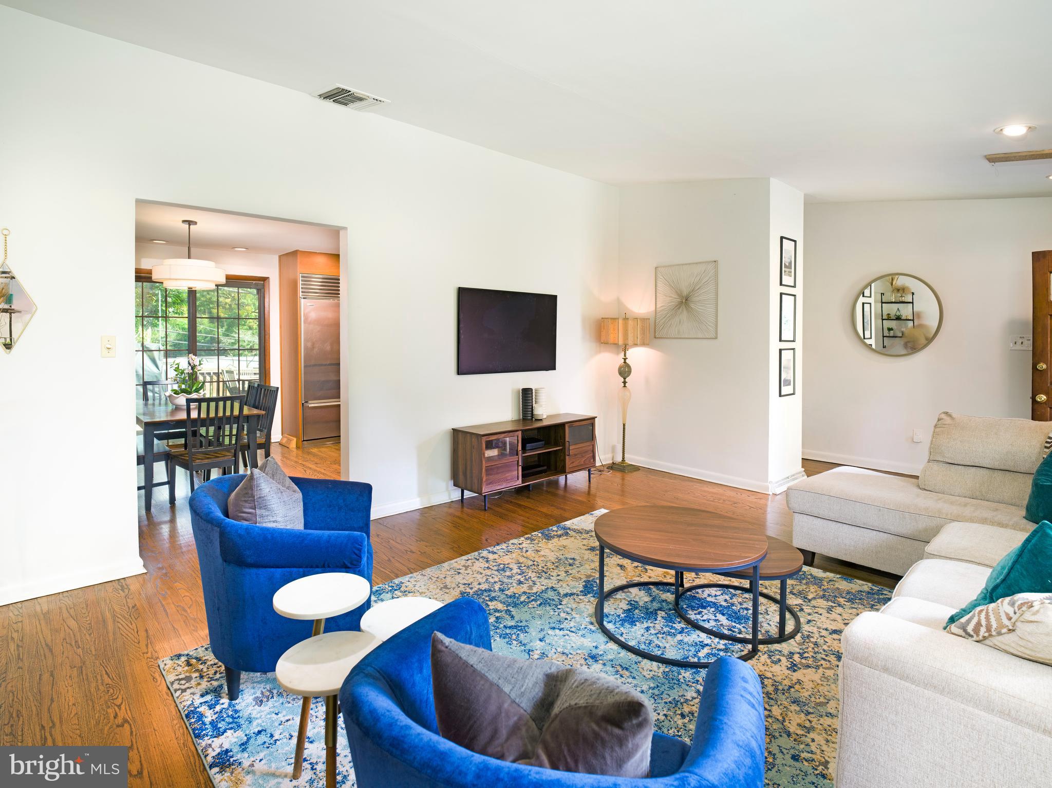 123 Old Forest Road Wynnewood, PA 19096 - Photo 6 of 29 a living room with furniture and a flat screen tv
