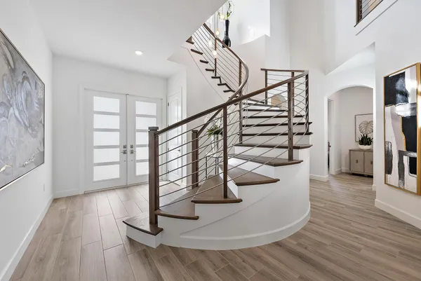a kitchen with stainless steel appliances kitchen island granite countertop a stove a sink and a microwave